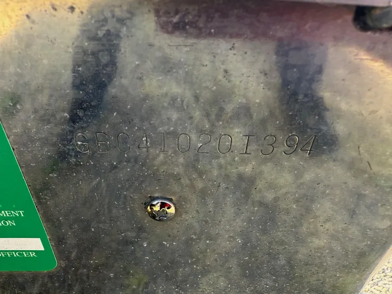 Slide: The Image of Serial number on 1994 Gregor CH-42L metal surface with green label. - 8