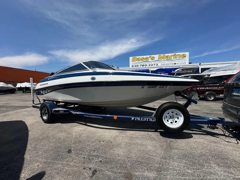 Slide: The Image of 2002 Crownline 180 BR boat on trailer at Basset Marine dealership. - 0