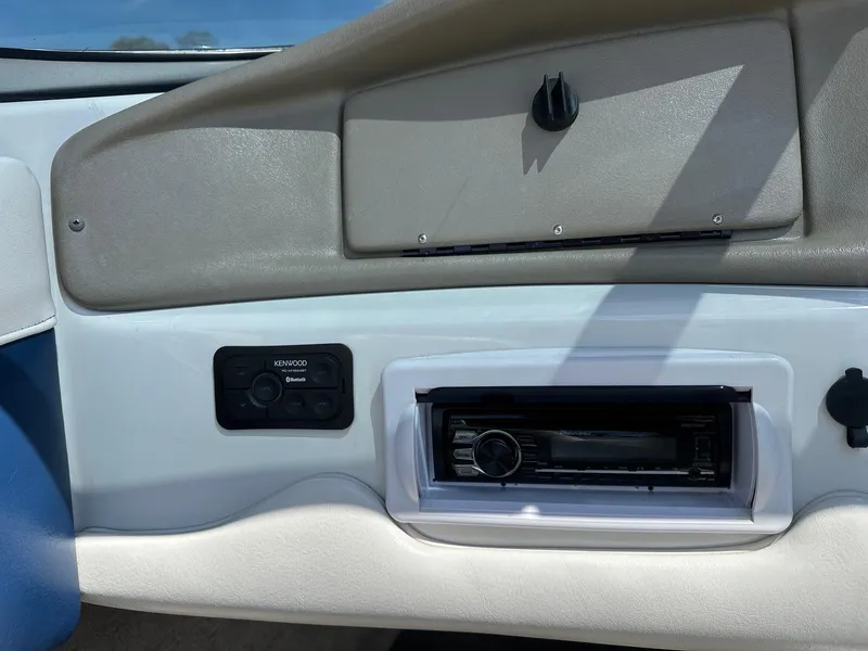 Slide: The Image of Dashboard of a 2002 Crownline 180 BR boat with stereo system and controls. - 3