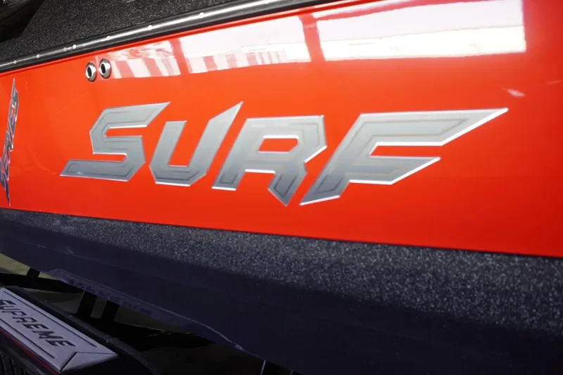 Slide: The Image of 2017 Supreme S211 boat with bold "SURF" lettering on red background. - 11