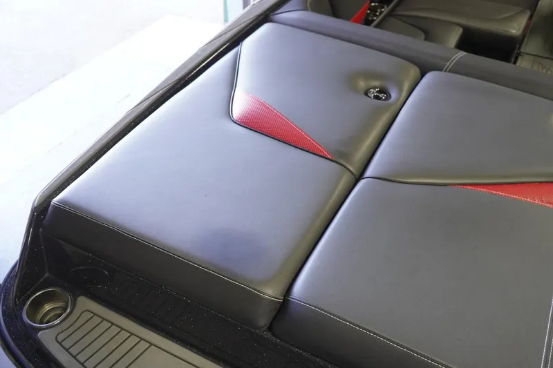 Slide: The Image of 2017 Supreme S211 boat interior with sleek black and red upholstery design. - 23
