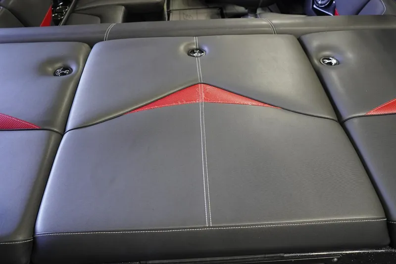 Slide: The Image of 2017 Supreme S211 boat interior with black and red upholstery design. - 24