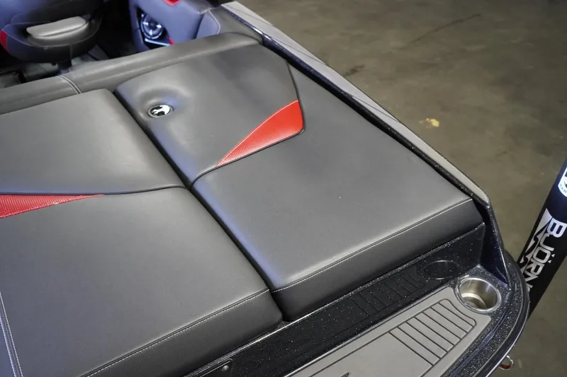 Slide: The Image of 2017 Supreme S211 boat interior with black and red upholstery, showcasing sleek design. - 25