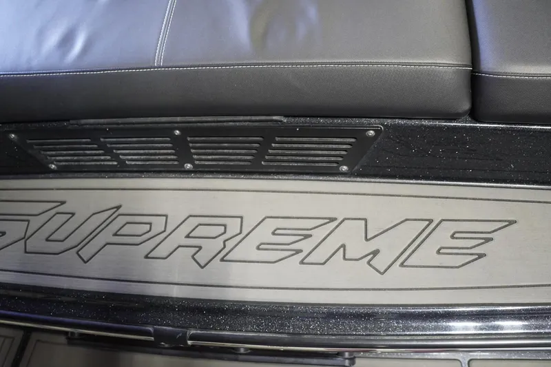 Slide: The Image of 2017 Supreme S211 boat interior with logo and seating detail. - 28