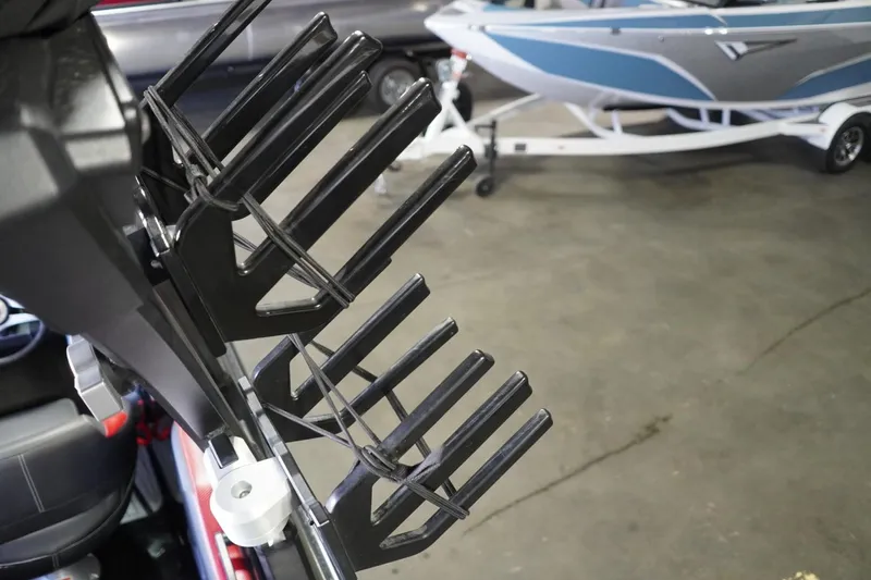 Slide: The Image of Wakeboard rack on a 2017 Supreme S211 boat, with a trailer in the background. - 31