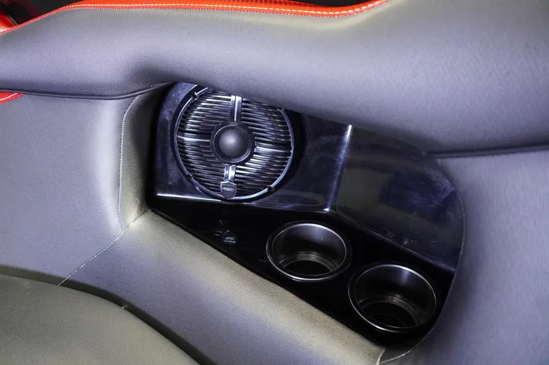 Slide: The Image of 2017 Supreme S211 interior detail with speaker and cup holders, featuring red stitching. - 36