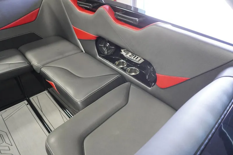 Slide: The Image of 2017 Supreme S211 interior with gray and red seating, featuring cup holders and sleek design. - 42