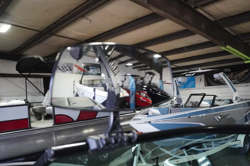 Slide: The Image of 2017 Supreme S211 boat interior with rearview mirror reflection in showroom. - 49