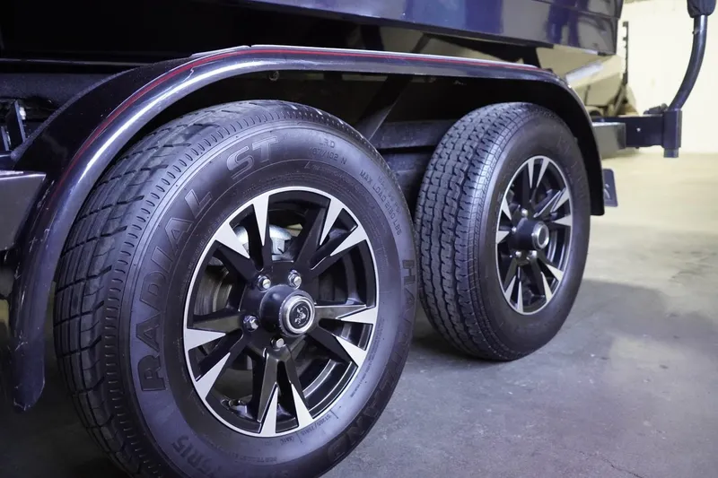 Slide: The Image of 2017 Supreme S211 trailer wheels, close-up view, featuring black and silver rims. - 9
