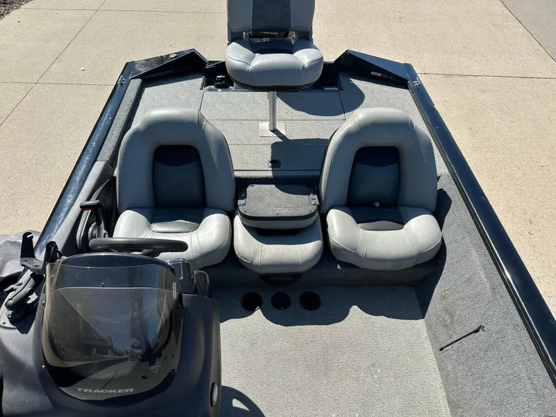 Slide: The Image of 2018 Tracker Pro Team 190 TX boat interior with gray seating and steering console. - 6