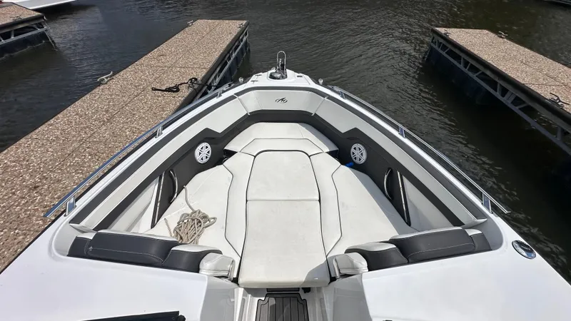Slide: The Image of 2019 Monterey 278SS boat with spacious seating at a dock. - 7