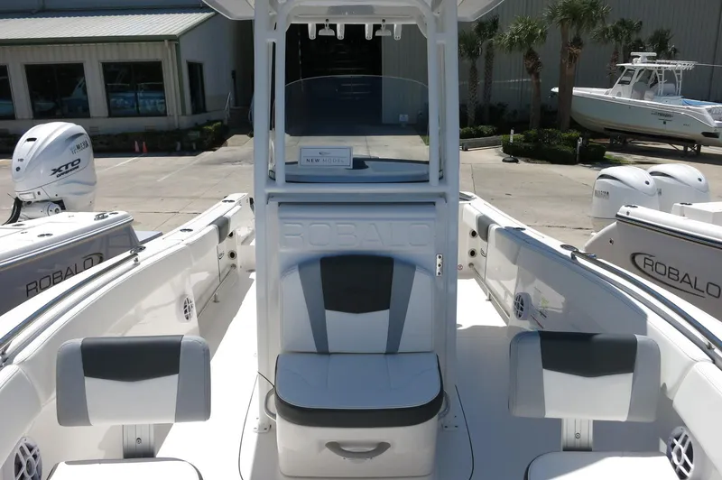 Slide: The Image of 2025 Robalo R230 Center Console boat interior with seating and console view. - 15
