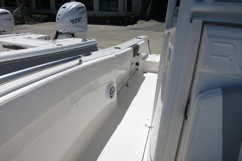 Slide: The Image of 2025 Robalo R230 Center Console boat deck with Yamaha XTO outboard engine. - 18
