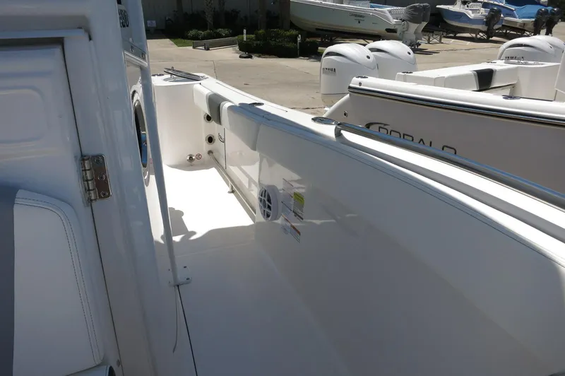 Slide: The Image of 2025 Robalo R230 Center Console boat interior, showcasing sleek design and spacious layout. - 19