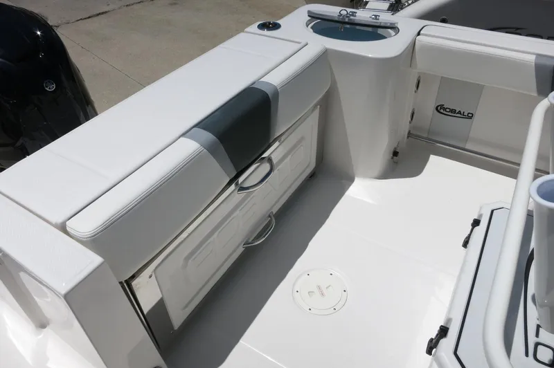 Slide: The Image of 2025 Robalo R230 Center Console boat interior with storage and seating. - 25