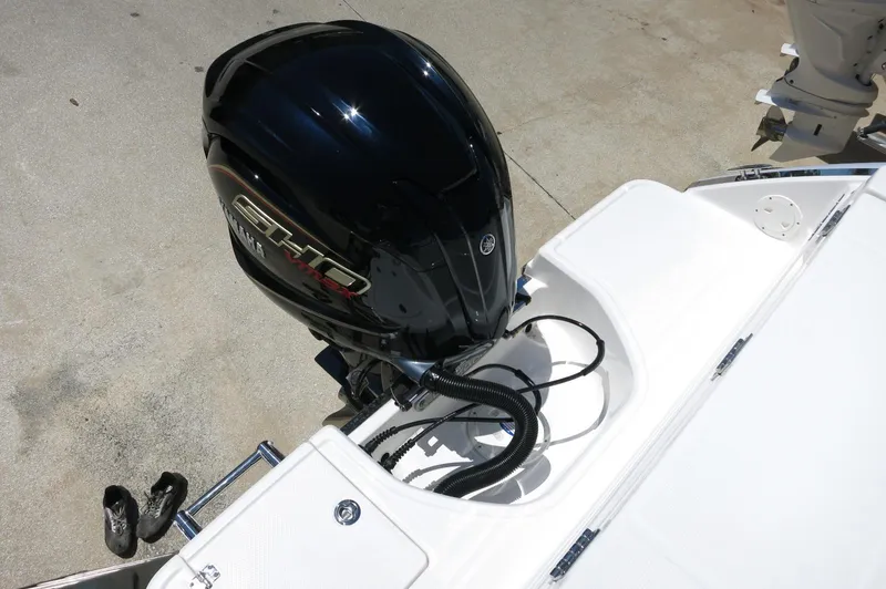 Slide: The Image of 2025 Robalo R230 Center Console boat with powerful outboard motor. - 32