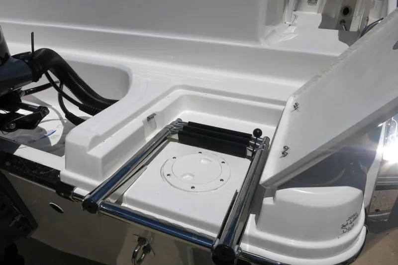 Slide: The Image of 2025 Robalo R230 Center Console boat with foldable swim ladder. - 8