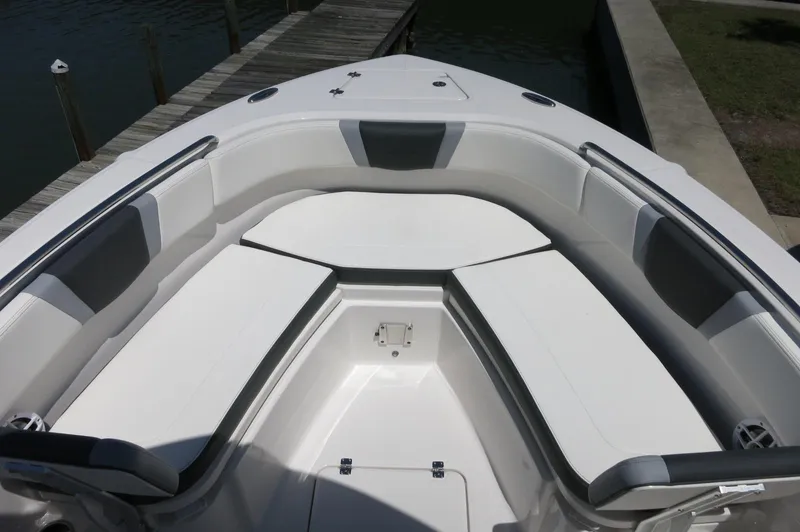 Slide: The Image of 2025 Robalo R230 Center Console boat interior with cushioned seating and sleek design. - 9
