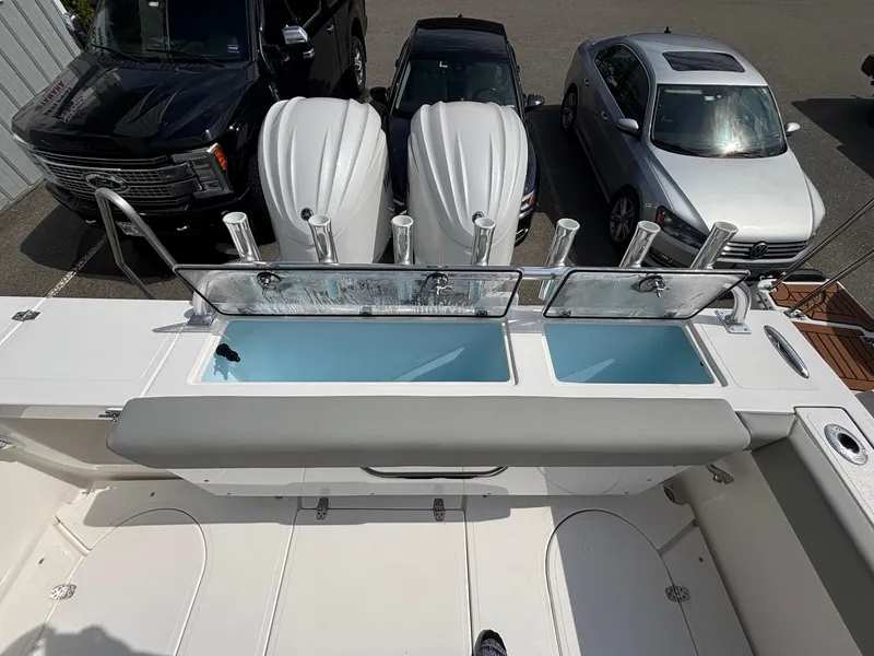 Slide: The Image of 2025 NorthCoast 315 HT boat with dual outboard motors and spacious deck layout. - 8
