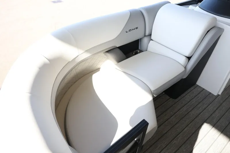 Slide: The Image of 2025 Lowe SS 210 DL boat with luxurious white seating on deck. - 13