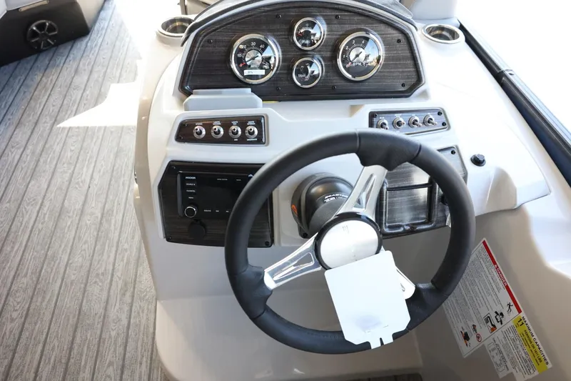 Slide: The Image of Steering console of 2025 Lowe SS 210 DL boat with gauges and controls. - 16