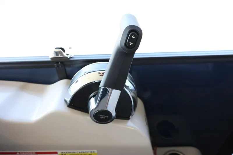 Slide: The Image of Throttle control lever on 2025 Lowe SS 210 DL boat dashboard. - 20