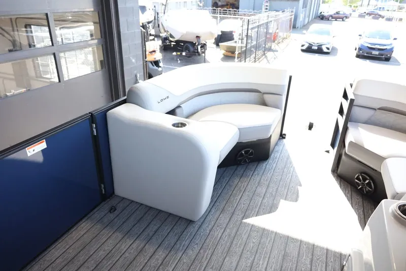 Slide: The Image of 2025 Lowe SS 210 DL pontoon boat interior with gray seating and modern design. - 21