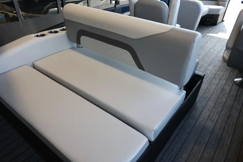 Slide: The Image of 2025 Lowe SS 210 DL boat interior with sleek, modern seating and cup holders. - 24