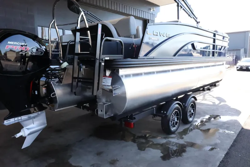 Slide: The Image of 2025 Lowe SS 210 DL pontoon boat on trailer, featuring Mercury Pro XS engine. - 8