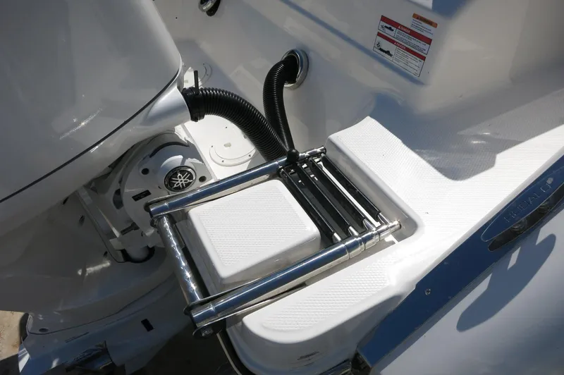 Slide: The Image of 2025 Robalo R250 Center Console boat with stainless steel swim ladder detail. - 13
