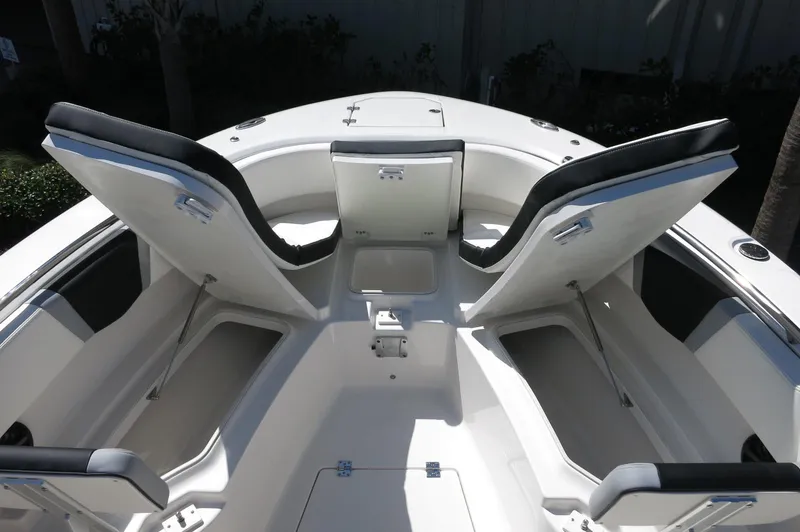 Slide: The Image of 2025 Robalo R250 Center Console boat with open storage compartments. - 20