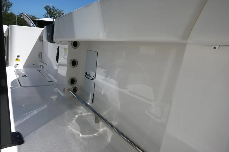 Slide: The Image of 2025 Robalo R250 Center Console boat interior, showcasing sleek white design and modern features. - 30