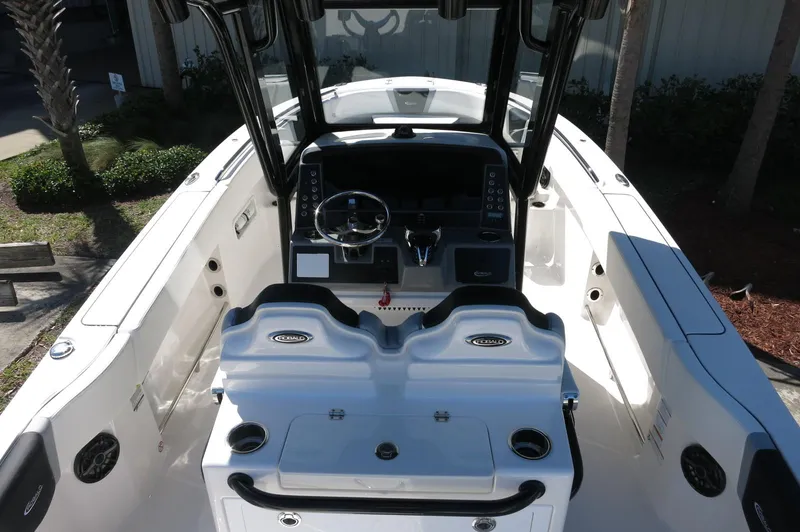 Slide: The Image of 2025 Robalo R250 Center Console boat interior with dual seating and steering console. - 34