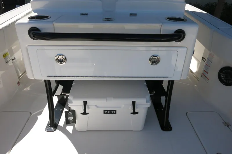Slide: The Image of 2025 Robalo R250 Center Console with Yeti cooler and storage compartment. - 36