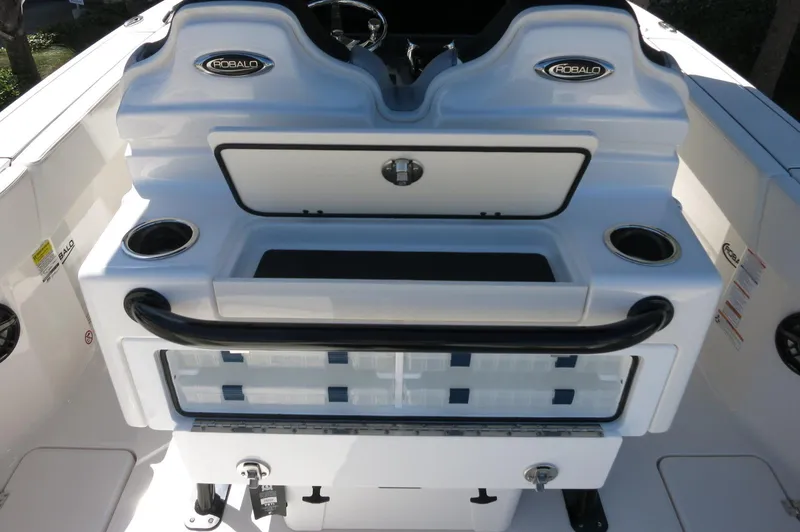 Slide: The Image of 2025 Robalo R250 Center Console boat interior with dual seats and storage compartments. - 47
