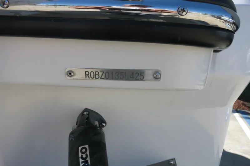 Slide: The Image of 2025 Robalo R250 Center Console boat with visible identification plate. - 9