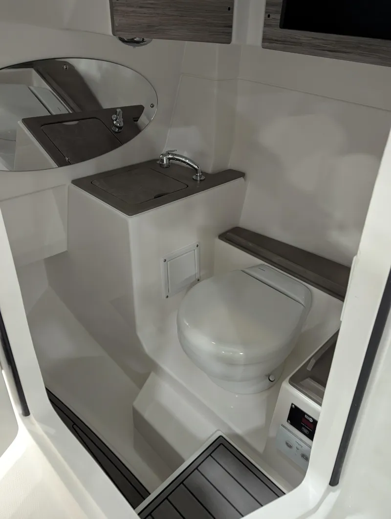 Slide: The Image of 2025 Edgewater 262 CX boat interior with modern bathroom amenities. - 8