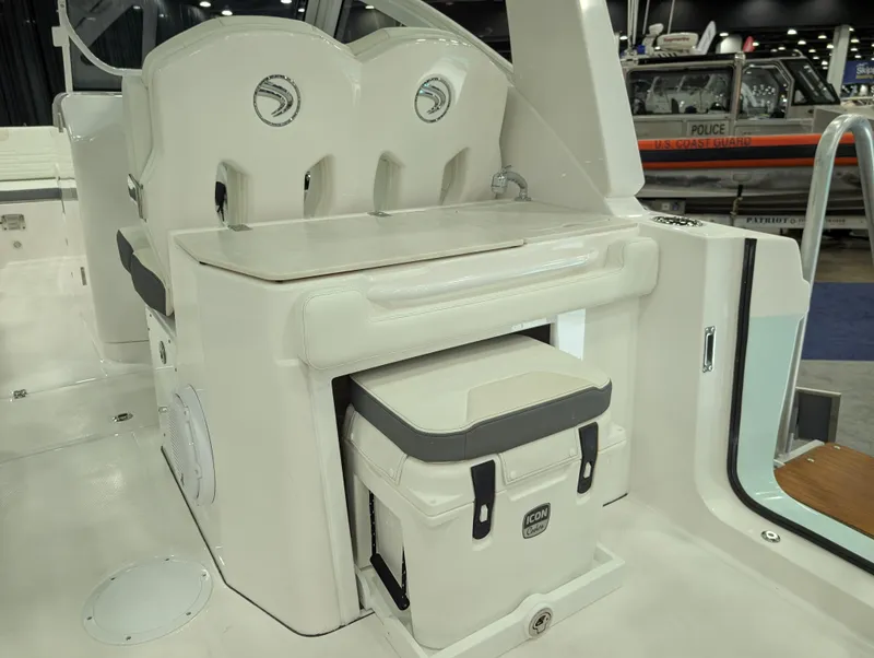 Slide: The Image of 2025 Edgewater 262 CX boat interior with seating and storage area. - 9