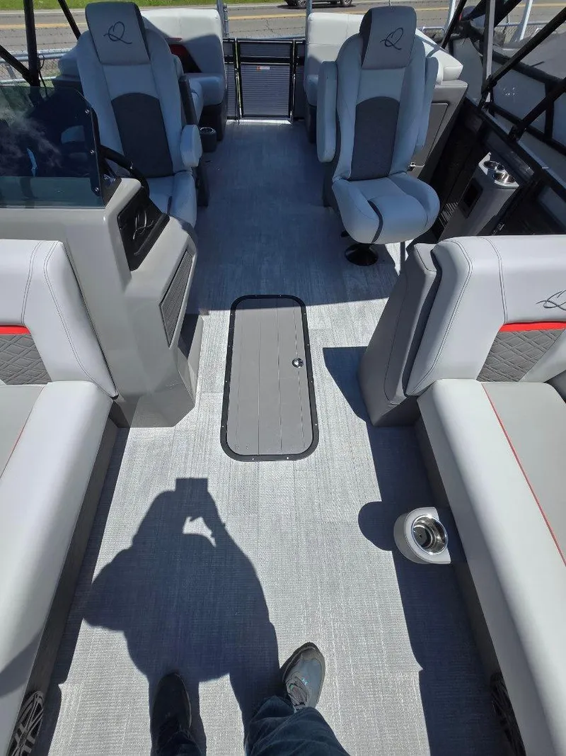Slide: The Image of 2025 Quest 22rls boat interior with gray seating and modern design. - 15