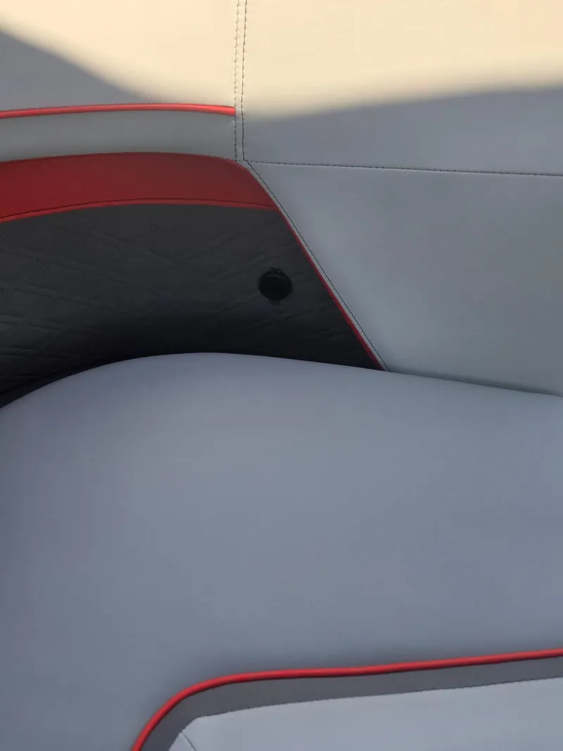 Slide: The Image of 2025 Quest 22rls interior seating with modern design and red accents. - 18