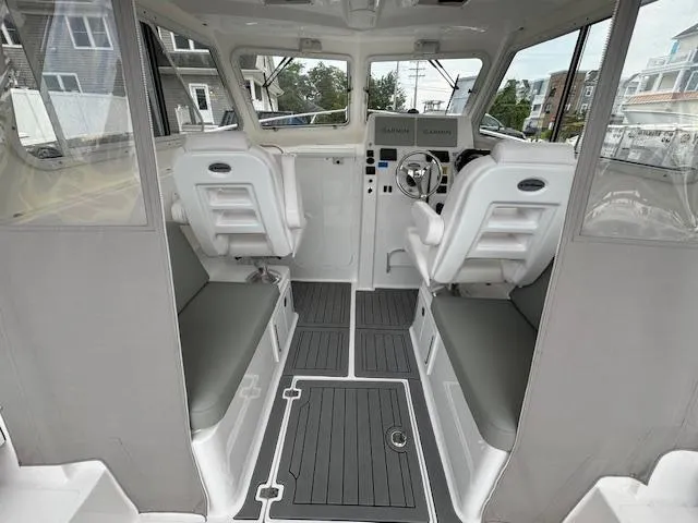 Slide: The Image of 2022 NorthCoast 255 Cabin interior with modern seating and steering wheel. - 11