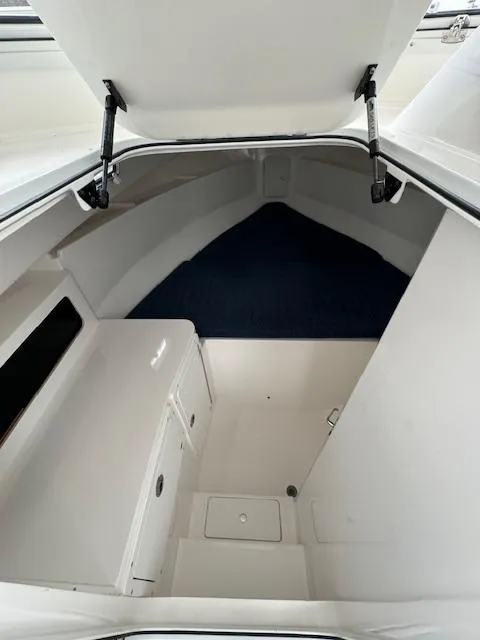 Slide: The Image of 2022 NorthCoast 255 Cabin interior, featuring spacious storage and seating area. - 13