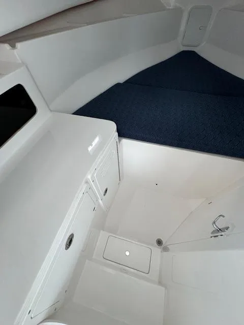 Slide: The Image of 2022 NorthCoast 255 Cabin interior with storage and sleeping area. - 14