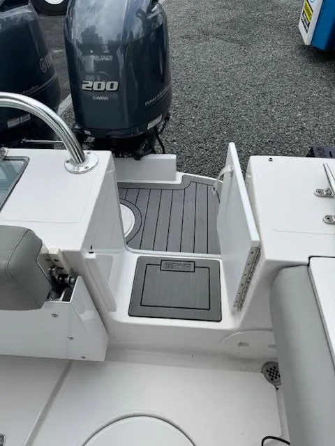 Slide: The Image of 2022 NorthCoast 255 Cabin boat with Yamaha 200 engine, featuring sleek deck design. - 6