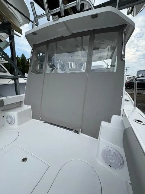 Slide: The Image of 2022 NorthCoast 255 Cabin boat with enclosed cockpit and modern design. - 7