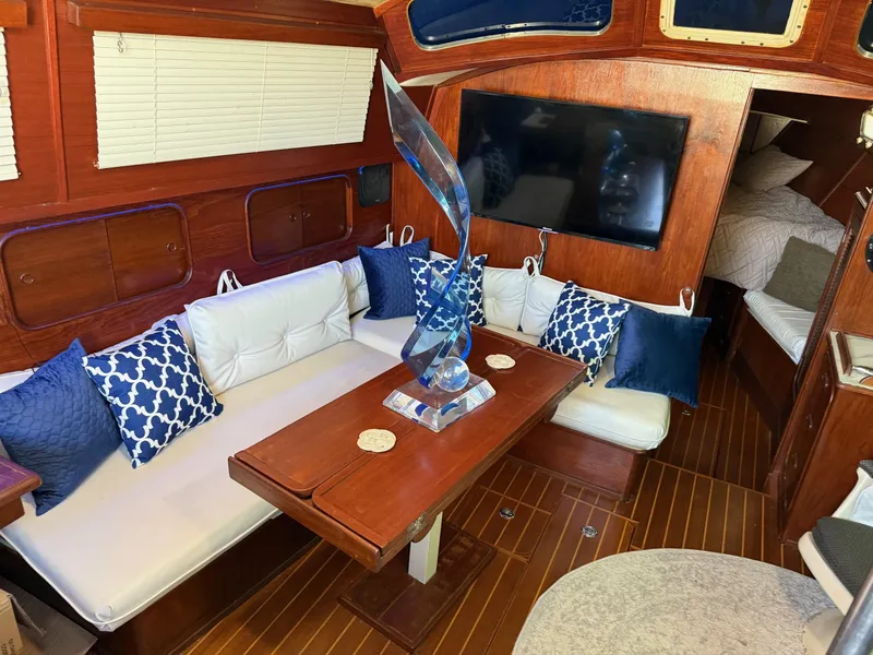 Slide: The Image of Luxurious 1982 Irwin 46 yacht interior with elegant seating, decorative pillows, and modern decor. - 16