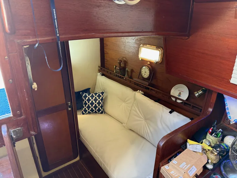 Slide: The Image of Cozy interior of 1982 Irwin 46 sailboat with wooden finish and nautical decor. - 17