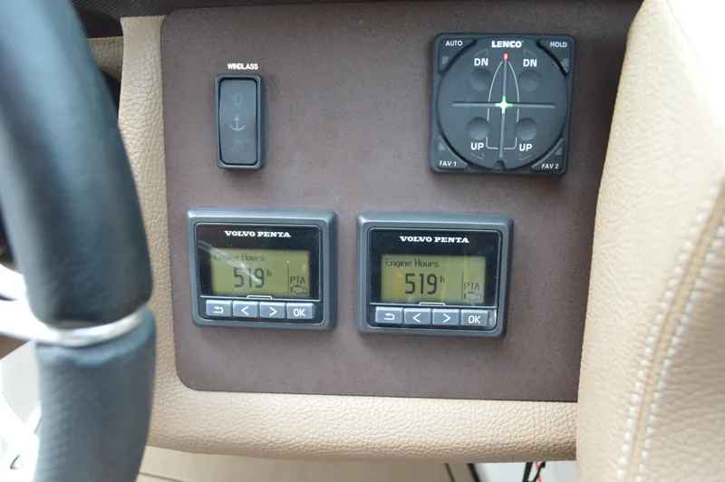 Slide: The Image of Control panel of a 2016 Cobalt 302 boat with Volvo Penta displays and Lenco trim tab controls. - 17