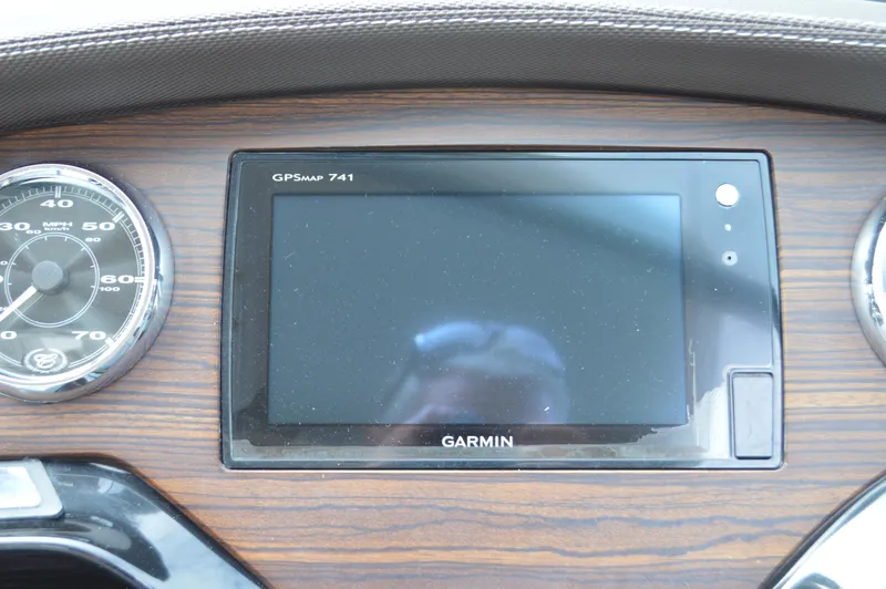 Slide: The Image of Garmin GPSmap 741 on 2016 Cobalt 302 dashboard with wood finish. - 19