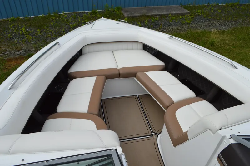 Slide: The Image of 2016 Cobalt 302 boat interior with white and tan seating arrangement. - 2